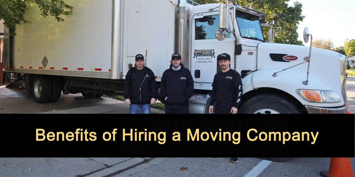 Deluxe Moving & Storage team posing in front of their moving truck