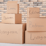 labelled moving boxes by room